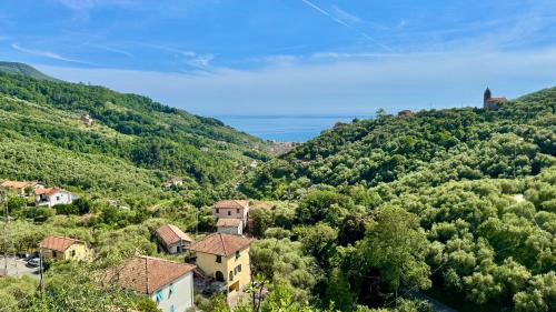 a small village on a hill with trees at Foglie d'Argento in Moneglia