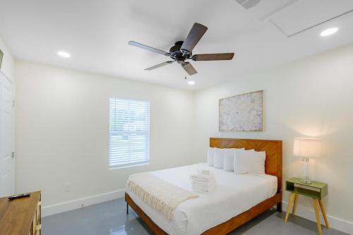 a bedroom with a bed with a ceiling fan at Peaceful Horizons at The Heron's Rest in Biloxi