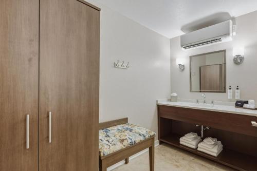 a bathroom with a sink and a mirror at The Water Street Inn in Ephraim