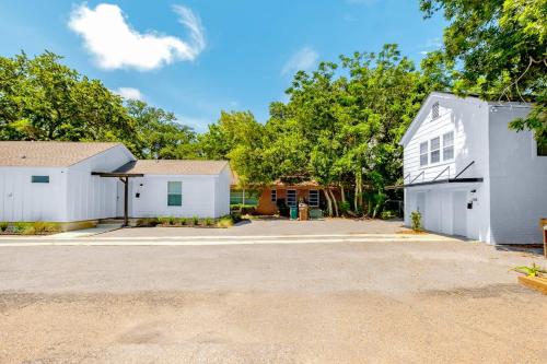 a white house with a garage and a driveway at Hopkins 144 in Biloxi