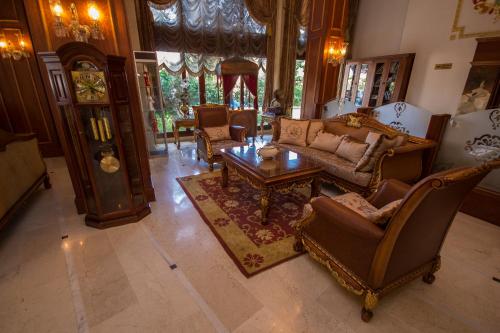 a living room with a couch and chairs and a table at Deluxe Golden Horn Sultanahmet Hotel in Istanbul