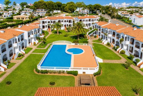 an aerial view of a villa with a swimming pool at Turquoise Menorca By the Sea in Son Bou
