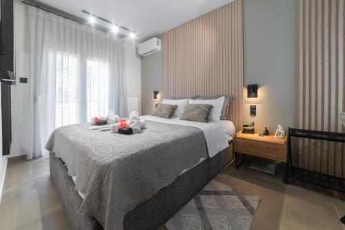 a bedroom with a large bed with teddy bears on it at Friendly Backyard in Thessaloniki