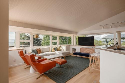 a living room with a couch and a table at Crows Nest Condo 3BR Downtown in Anchorage