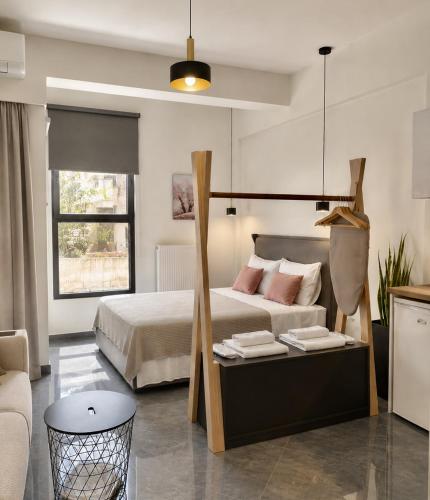 a bedroom with a large bed with pink pillows at ATHENIAN Vibes in Athens
