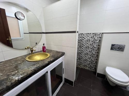a bathroom with a sink and a toilet at Stars Hostel Tangier in Tangier