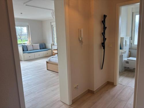 a view of a living room with a phone on the wall at Seeblick Apartments Mühlau in Mühlau