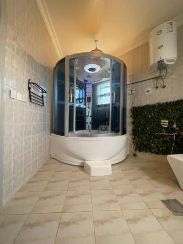 a bathroom with a sink and a toilet in a room at دار ناصر in Riyadh