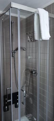 a bathroom with a shower with a glass door at StellinAmare in Sestri Levante