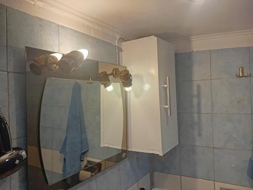 a bathroom with a mirror and a sink and a shower at Casa MUSA in Keratea