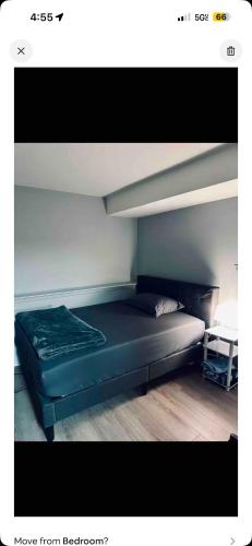 a bed sitting in a room with at Completely private big apartment in North Babylon