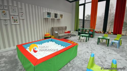 a rendering of a living room with a waiting area at Termy Warmińskie in Lidzbark Warmiński
