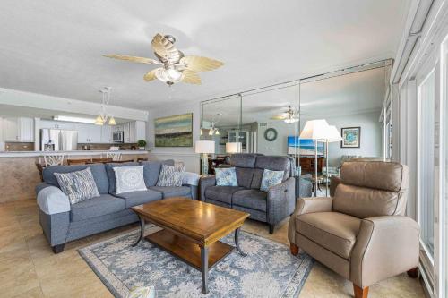 a living room with a couch and chairs and a table at Islander E 7011 Stunning oceanfront condo with pool & gym access in Fort Walton Beach