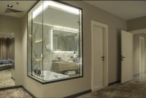 a bathroom with a sink and a mirror at فندق راسيا in Medina