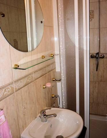 a bathroom with a sink and a mirror at Penzion Oáza Hřensko in Hřensko