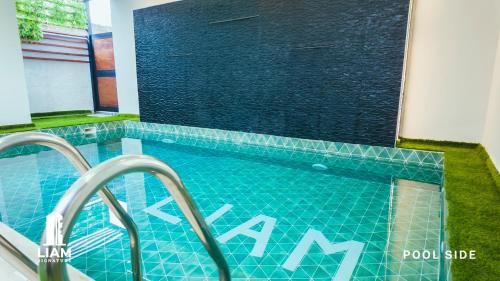 a swimming pool in front of a building at Studio Apartment -LIAM Signature Akowonjo Egbeda in Akinde