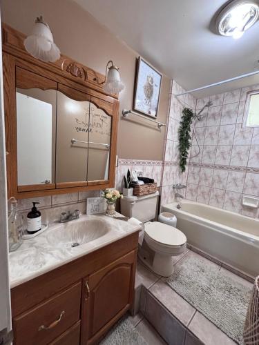 a bathroom with a sink and a toilet and a tub at Casa Rosarito beach in Rosarito Beach