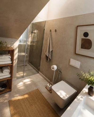 a bathroom with a shower and a toilet and a sink at Rosemarine Villa in Draç