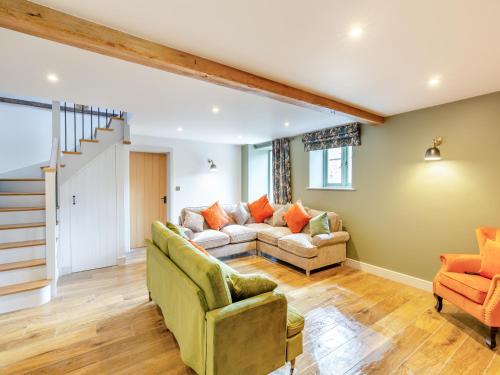 a living room with a couch and two chairs at The Stables - Uk44139 in Baystonhill