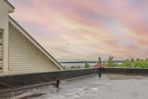 a house with a balcony with a view of the water at Downtown 1 Bedroom Flat with Views in Anchorage