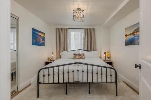 a bedroom with a bed and a window at Downtown 1 Bedroom Flat with Views in Anchorage