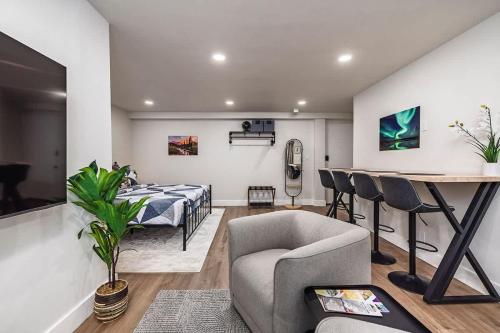 a living room with a bed and a table at King Bed Studio-Downtown Getaway in Anchorage