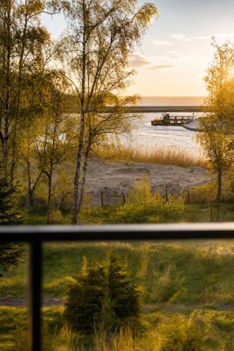 a view of a body of water with a dock at Sea View & SPA 10d10 in Dziwnów