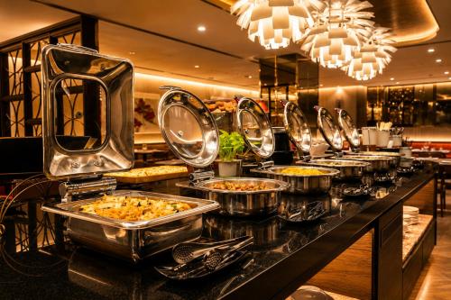 a buffet line with many trays of food at The Cloud Hotel in Kaohsiung
