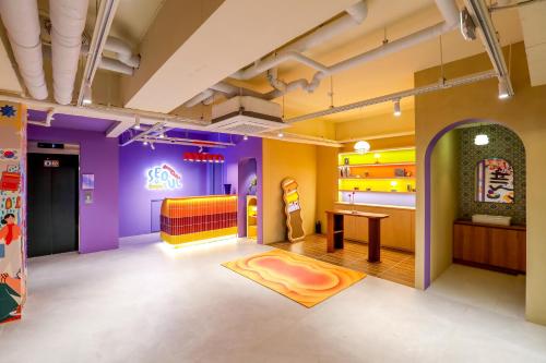 a room with purple and yellow walls at Hotelarrive Seoulful in Seoul