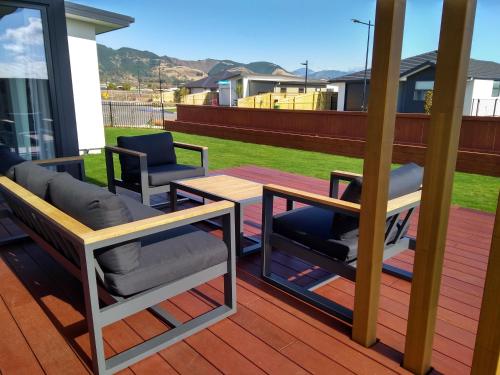 a patio with two chairs and a table on a deck at The Shepherds Retreat in Richmond