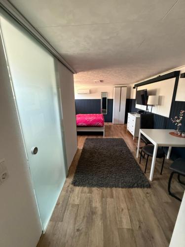 a living room with a couch and a table at Apartment im Heidchen in Knüllwald