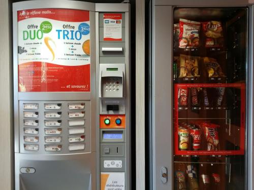 a drink vending machine with food and drinks in it at Première Classe Valence Sud in Valence