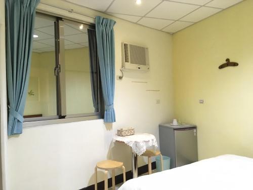 Ліжко або ліжка в номері HFun Hotel