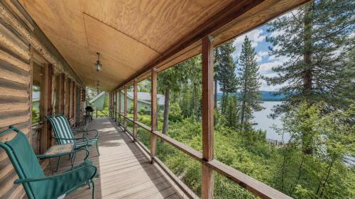 a porch with chairs and a view of a lake at McCall Lakehouse Private Dock Beach & Grill in McCall