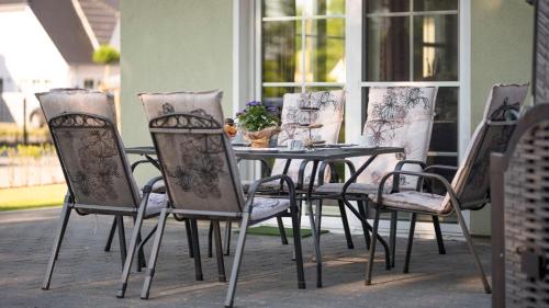 a table and chairs sitting on a patio at Ferienhaus Seegras in Groß Kirr