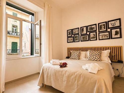 a bedroom with a large bed with a window at iPrincipati Luxury Living Suite in Salerno