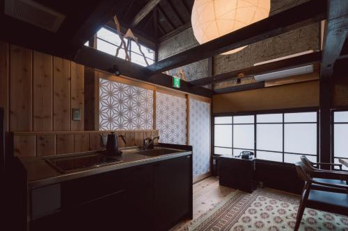 a kitchen with a sink and a counter top at RITA Okawa Hanzakai in Wakatsu