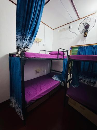 a room with two bunk beds in a tent at Echo Point in Trincomalee