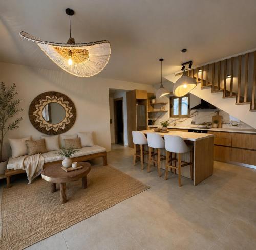 a living room with a couch and a table at Villa Magganas in Nikiana