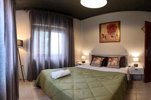 a bedroom with a large bed and a window at Thea Panorama in Makri