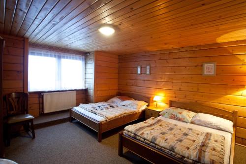 Ліжко або ліжка в номері Janosik