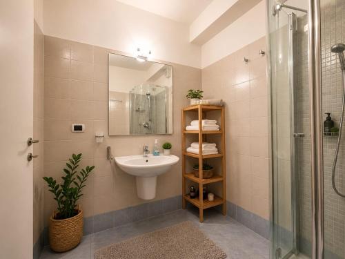 a bathroom with a sink and a shower at Il rifugio in Trento