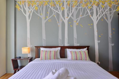 Una cama o camas en una habitación de Just Fine Krabi