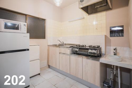 MOONLIGHT KEISEI KOIWA HOTEL 2-Minute Walk from Keisei Koiwa Station Washer & Dryer Included Completely Non-Smoking Perfect for Long Stays Direct Access to Ueno, Asakusa, and Narita Airport