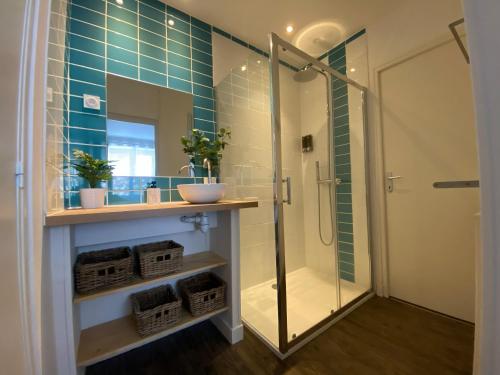 a bathroom with a glass shower and a sink at Ardeche2coeur in Marcols-les-Eaux