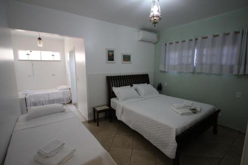 Katil atau katil-katil dalam bilik di Chácara Andó Bed And Breakfast