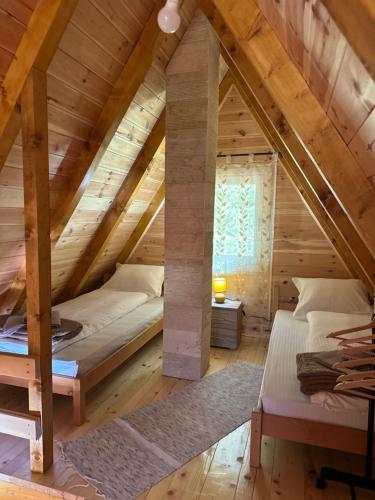 a bedroom with two beds in a attic at Apartman Boro in Žabljak