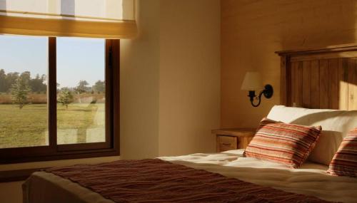 Una cama o camas en una habitación de Alma Pampa
