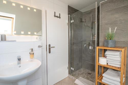 a bathroom with a sink and a shower at Fewo Büsum in Büsum