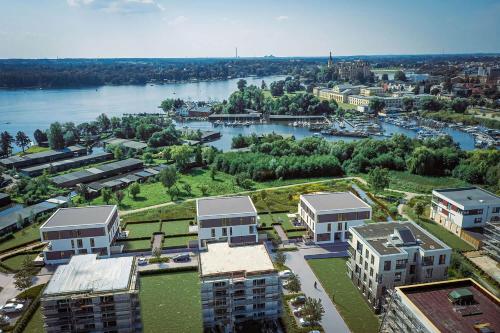 an aerial view of a city with a river and buildings at FeWo RoSi SN in Schwerin